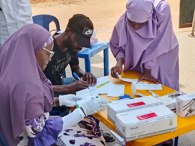 Registration and paperwork at HIV testing table